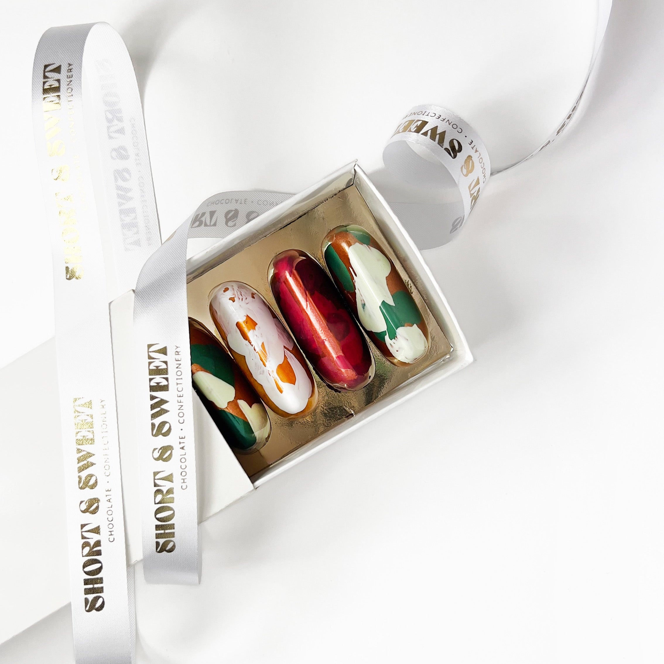 Box of chocolates with a ribbon on a white background