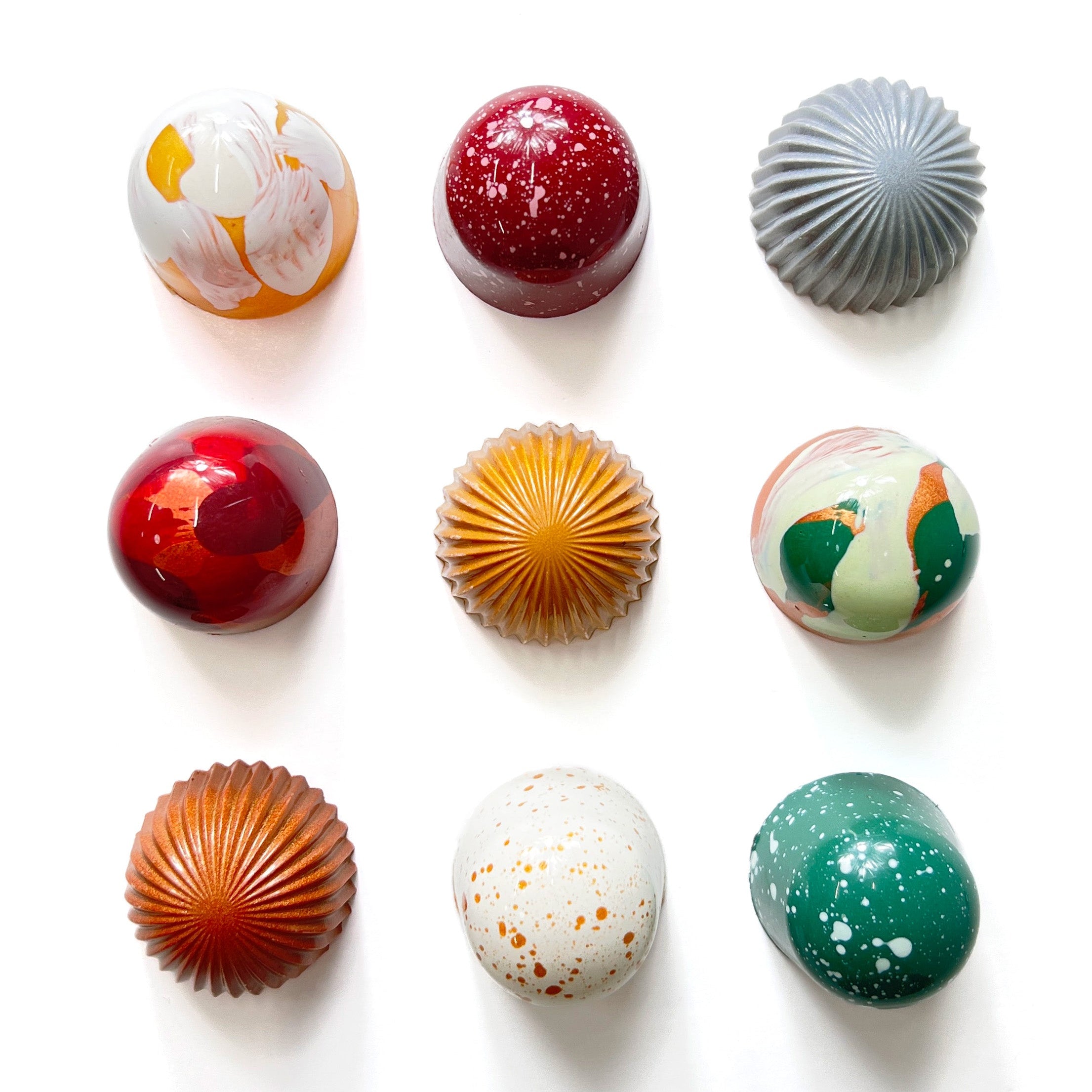 Assorted chocolate bonbons on a white background